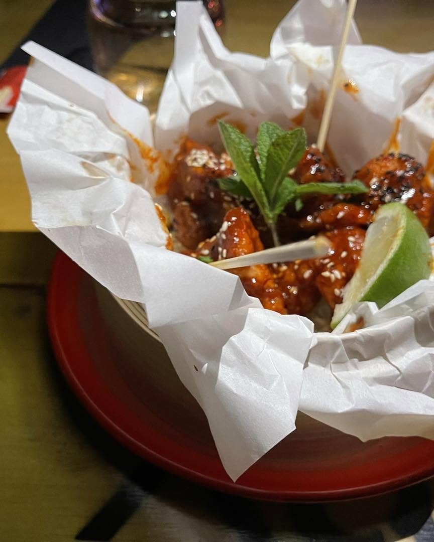 Thai crispy chicken glazed in hot honey over rice